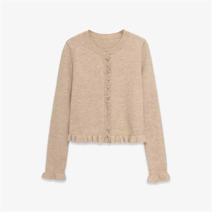 Dames cardigan en tricot confortable avec des boutons décoratifs et un design à volants tendance Chic und Stil