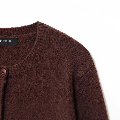 Ladies cozy knit pullover with classic buttons and a round collar Chic and Style