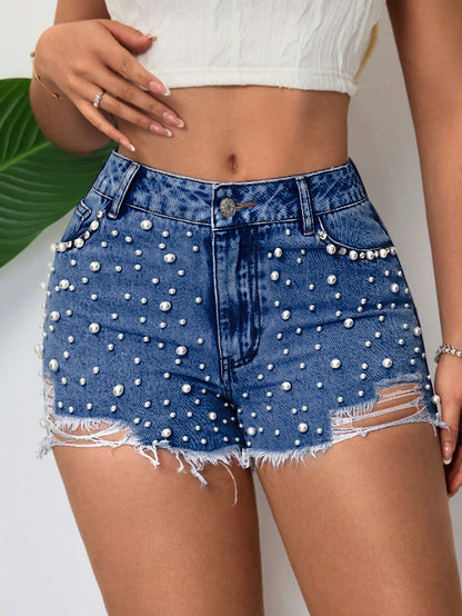 Shorts en denim pour femmes avec décoration en perles et ourlet effiloché Chic und Stil