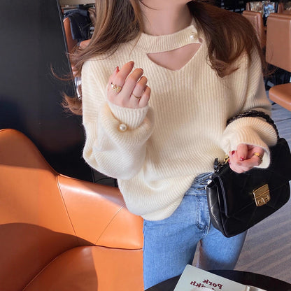 Pull en tricot pour femmes avec un look cut-out raffiné et des manches ornées de perles Chic und Stil