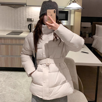 Classic women's down jacket with high collar and practical pockets. Chic and stylish.