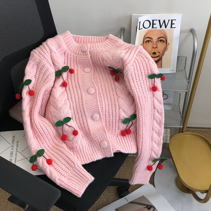 Pull en grosse maille pour femmes avec des appliqués floraux et des détails de boutons Chic und Stil