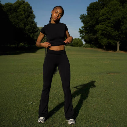 Chic and Style ladies' sporty outfit with fitted top and flared pants