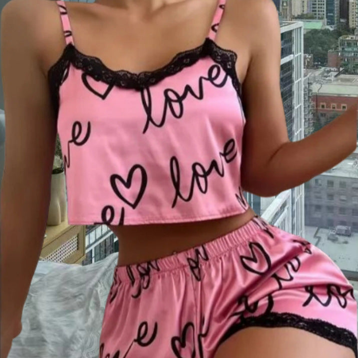 Chic and Style women's satin crop top and shorts set with hearts and lace accents