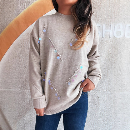 Pull femme avec des détails en perles et en strass à la mode Chic und Stil
