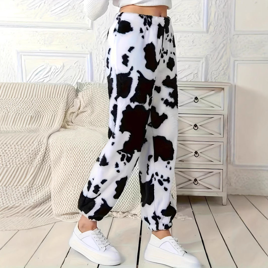 Ladies plush pants with a trendy cow spot pattern and elastic waist Chic and Style