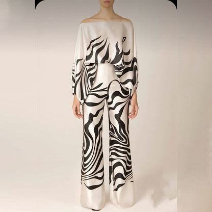 Dames combinaison élégante avec coupe asymétrique et motif accrocheur Chic und Stil