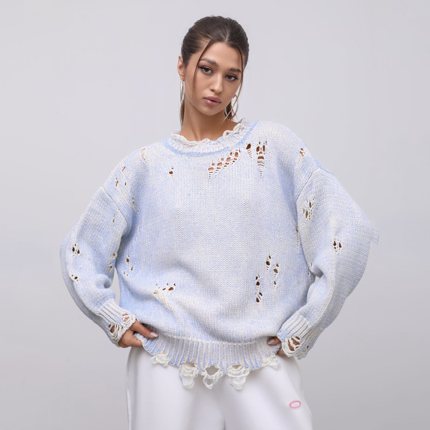 Ladies oversized knitted casual pullover with a unique hole pattern Chic and Style