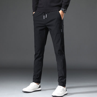 Men's slim fit sports pants with elastic waistband and practical zip pockets Chic and Style