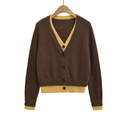 Pull élégant pour femmes avec décolleté en V profond et boutons décoratifs Chic und Stil