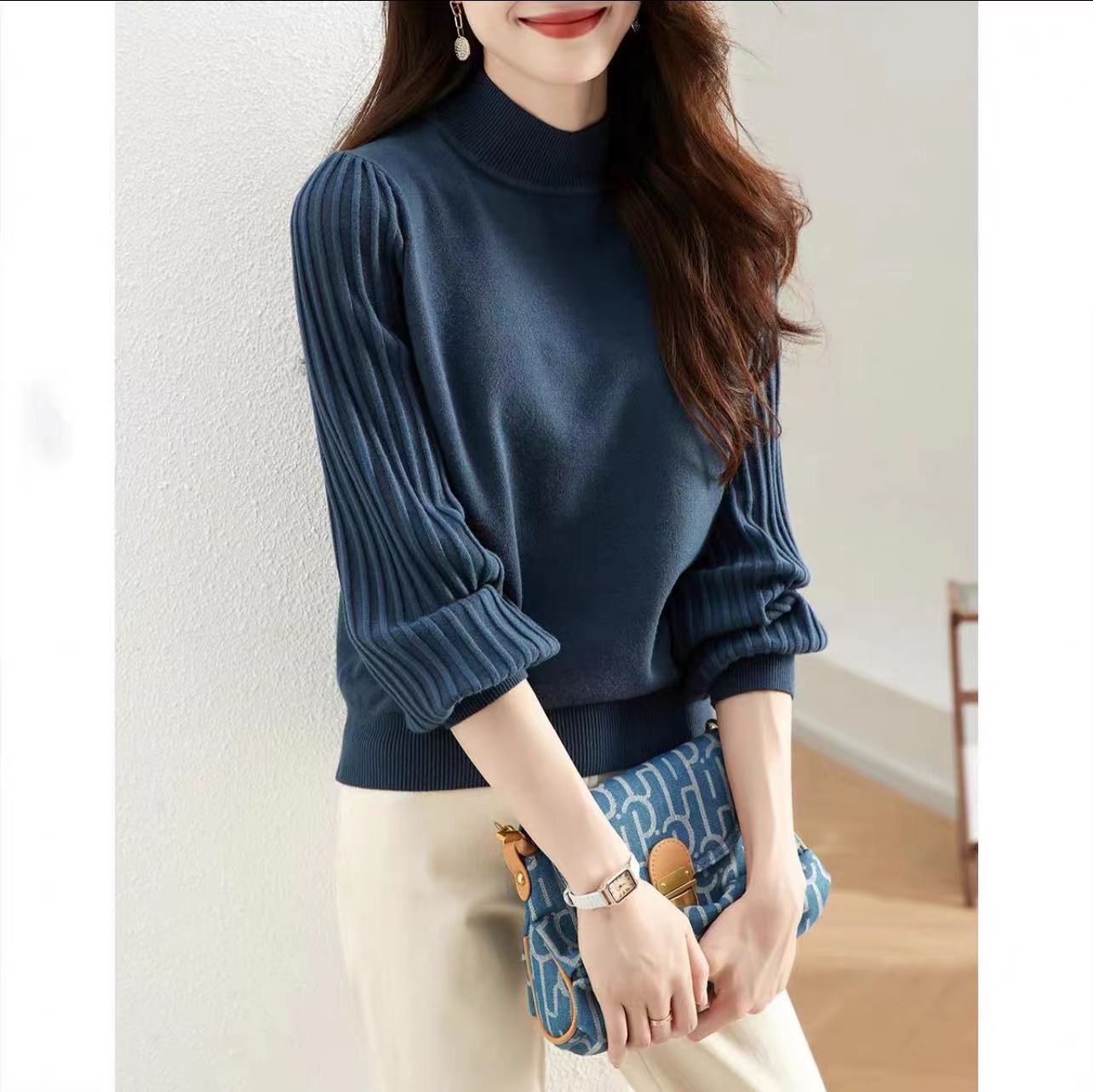 Pull élégant pour femmes avec des manches tricotées hautes Chic und Stil