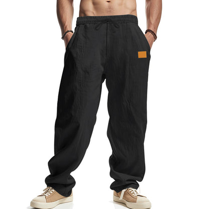 Linen pants for men with a relaxed fit featuring an adjustable drawstring and practical side pockets Chic and Style