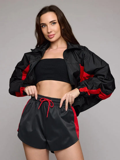 Women's athletic workout clothing with a highly functional jacket and chic stylish shorts