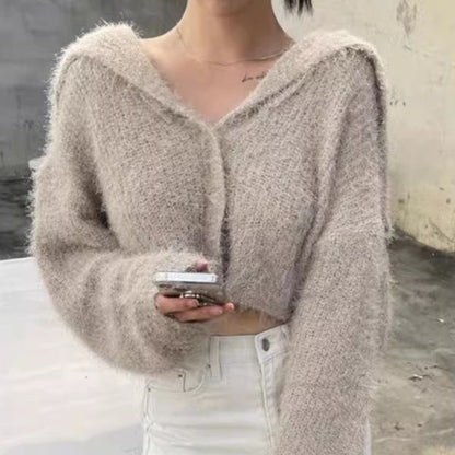 Pull décontracté pour femmes avec décolleté en V profond et motif de mailles texturé Chic und Stil