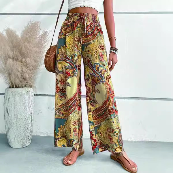 Wide palazzo pants for women with a colorful paisley pattern and an elastic waistband Chic und Stil
