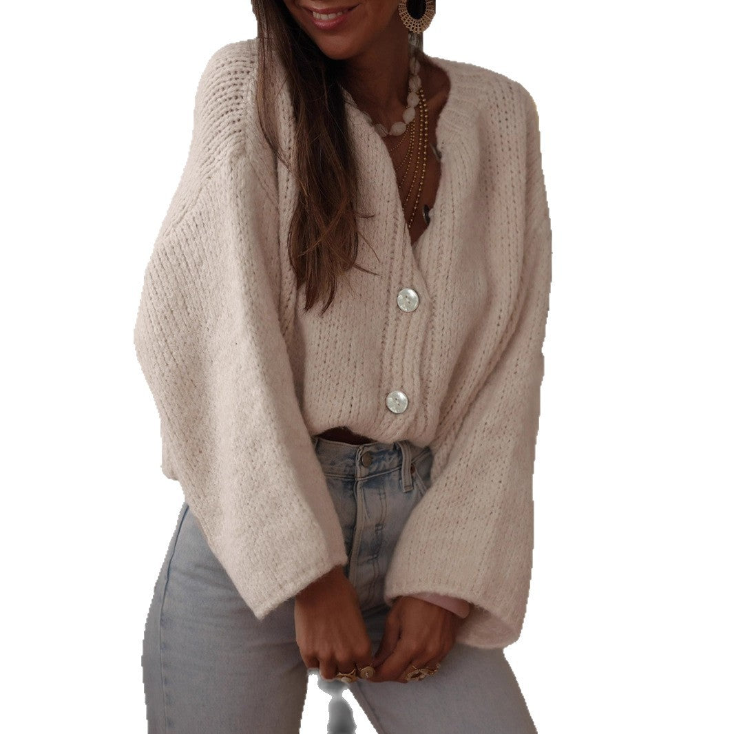 Dames pull-over confortable avec des manches surdimensionnées et de élégants boutons en perles Chic und Stil