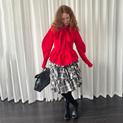 Pull femme avec détail de cravate et volants Chic und Stil