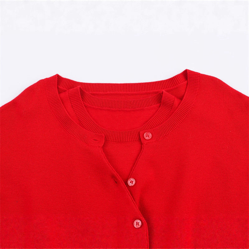 Pull en tricot court pour femmes avec détail de bouton et décolleté en V Chic und Stil