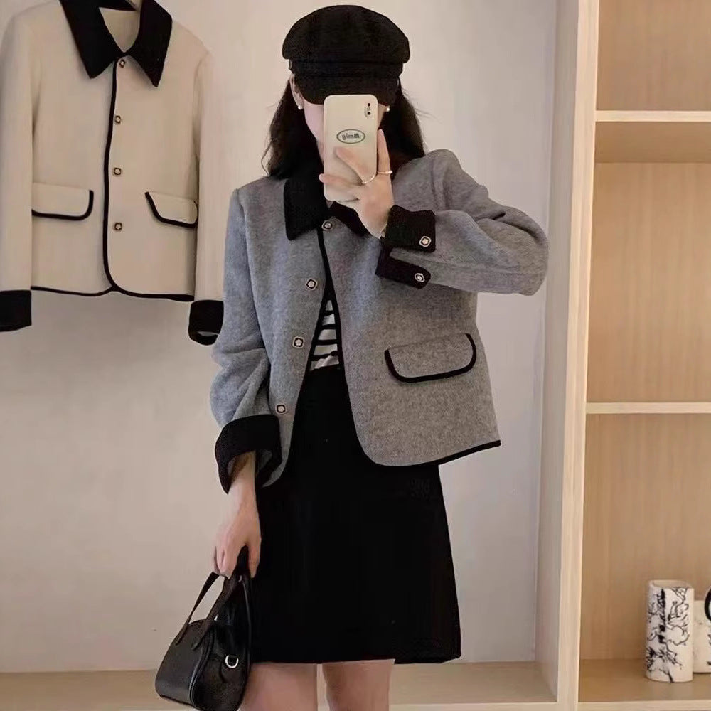 Dame élégante veste courte avec des détails contrastants Chic und Stil