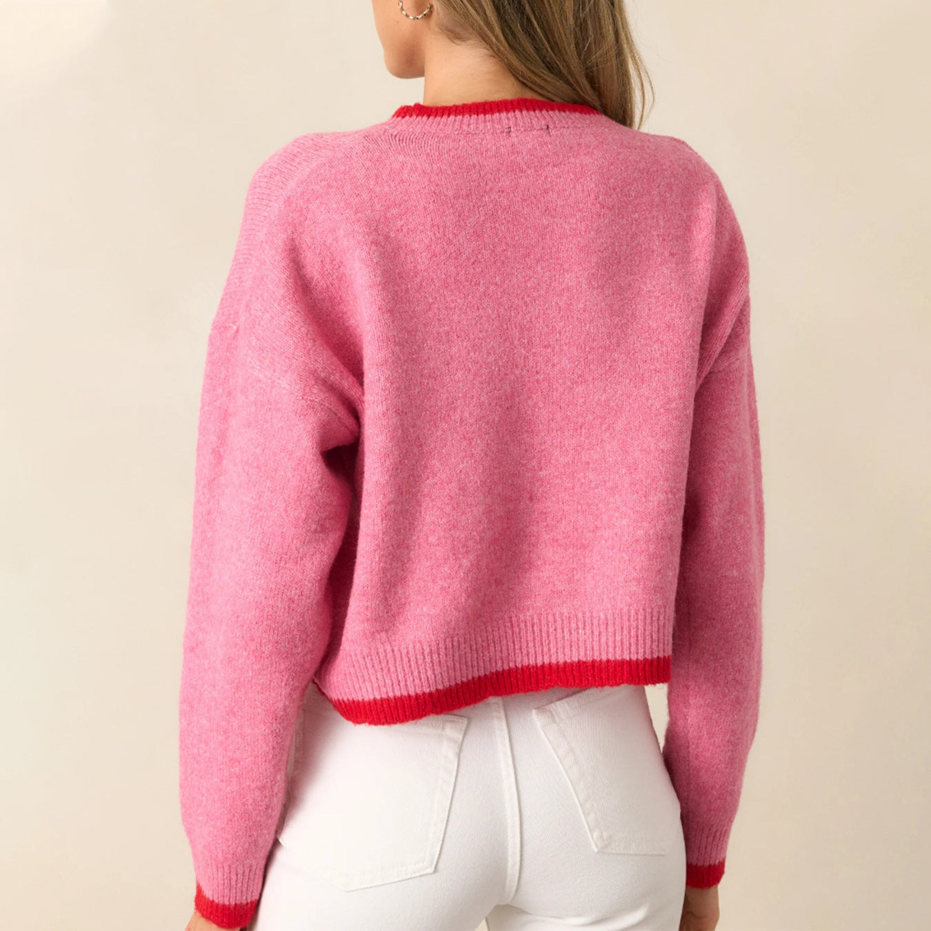 Pull tendance pour femmes avec motif fraise et poignets contrastés Chic und Stil