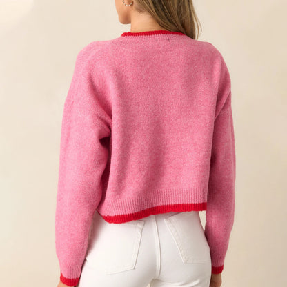 Pull tendance pour femmes avec motif fraise et poignets contrastés Chic und Stil