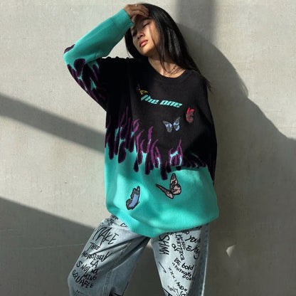 Pull en gros tricot pour femmes avec un design unique de flammes et de papillons Chic und Stil