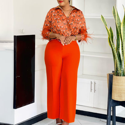 Expressive outfit for women with printed blouse and wide pants Chic and Style