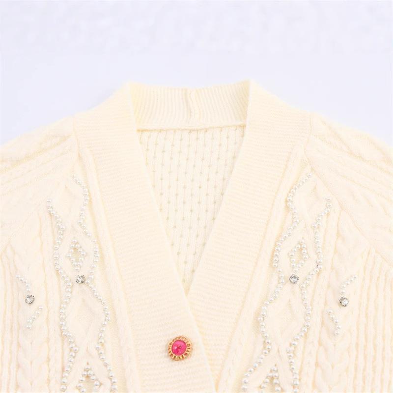 Knitted jacket for women with a detailed textured pattern and elegant ruffle details Chic and Style
