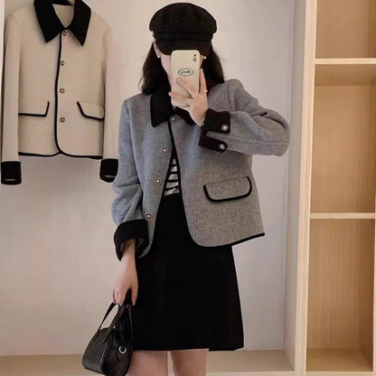 Dame élégante veste courte avec des détails contrastants Chic und Stil