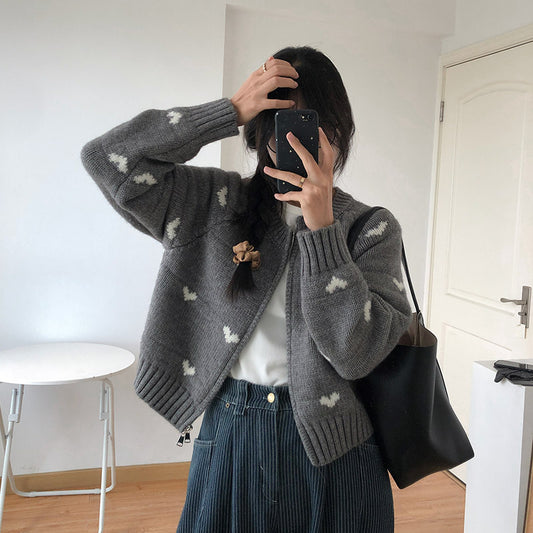 Women's comfortable cardigan with heart motif and elegant button detail. Chic and stylish.