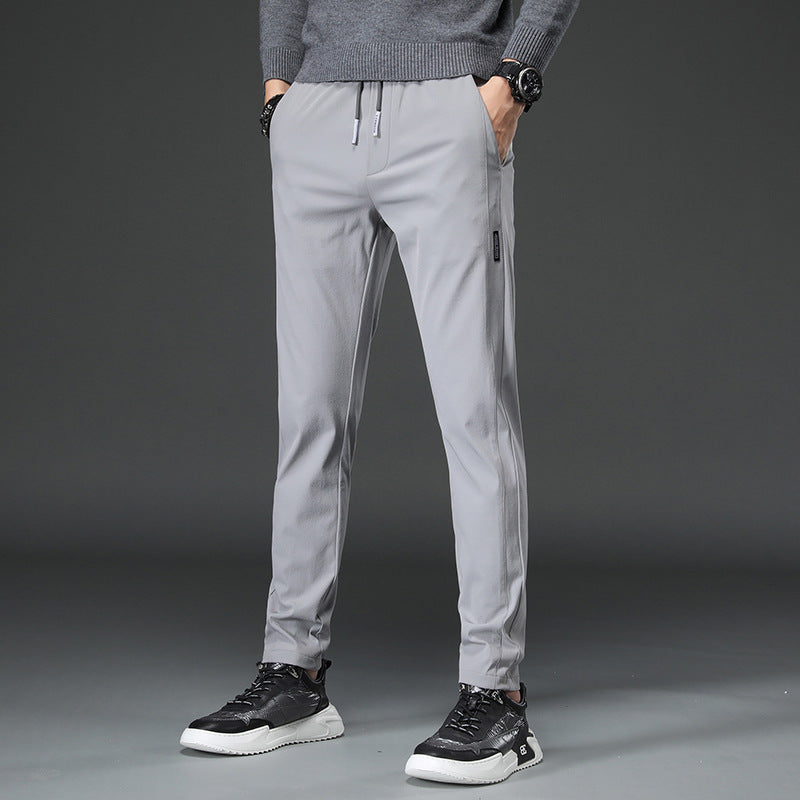 Men's slim fit sports pants with elastic waistband and practical zip pockets Chic and Style