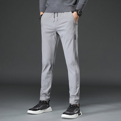 Men's slim fit sports pants with elastic waistband and practical zip pockets Chic and Style