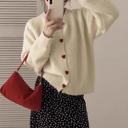 Dames pull-over tricot doux avec boutons en forme de cœur Chic und Stil