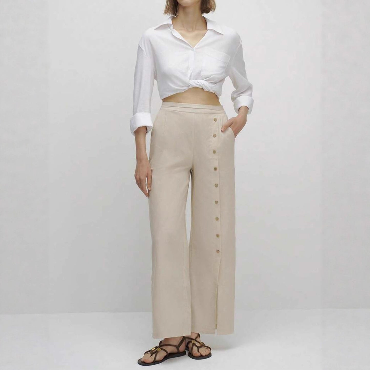 Linen wide-leg pants for women with button details and elegant slit Chic and Style
