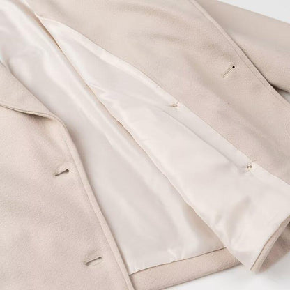 Elegant wool coat for women with double-breasted closure and modern details Chic and Style