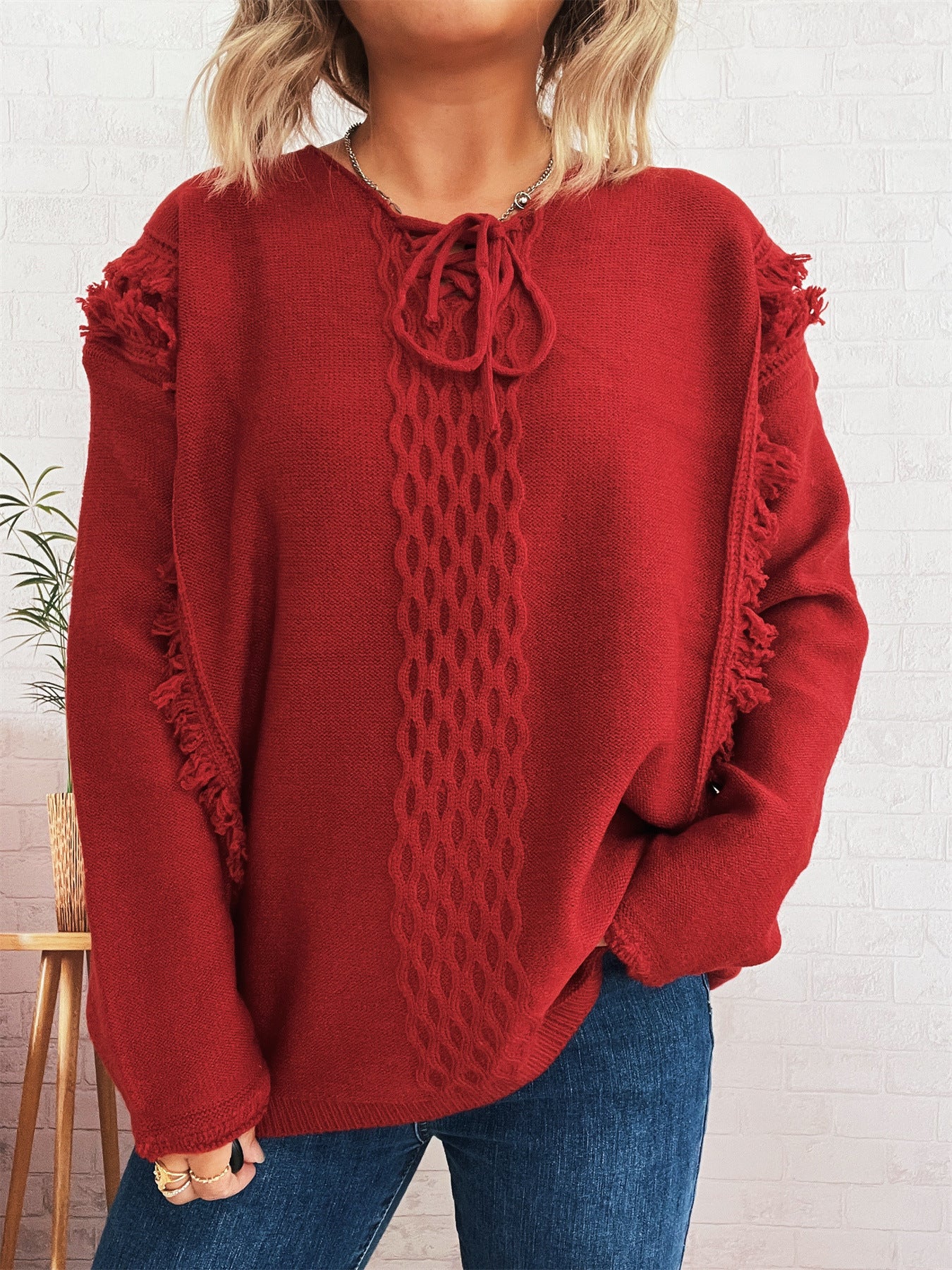 Pull en tricot oversize pour femmes avec un design de franges ludique et un motif en torsades Chic und Stil