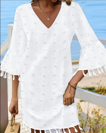 Robe de plage pour femmes avec un élégant décolleté en V et des franges décoratives Chic und Stil