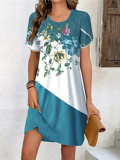 Robe d'été pour femmes avec un design floral créatif et une coupe asymétrique Chic und Stil