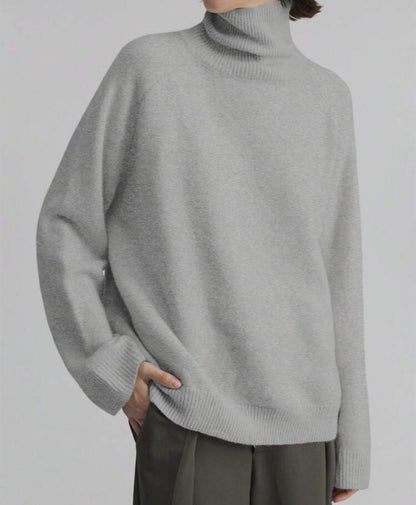Pull à col roulé féminin à coupe oversize et texture fine Chic und Stil