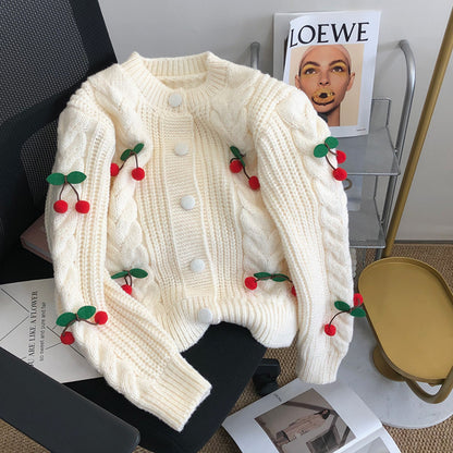 Pull en grosse maille pour femmes avec des appliqués floraux et des détails de boutons Chic und Stil