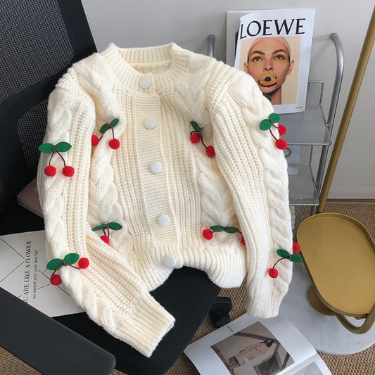 Pull en grosse maille pour femmes avec des appliqués floraux et des détails de boutons Chic und Stil