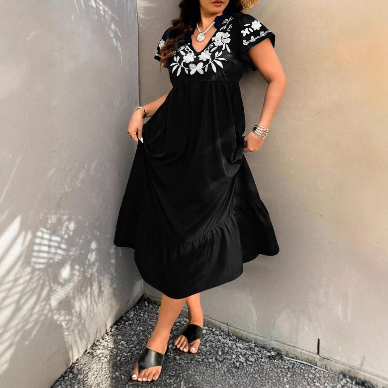 Robe maxi pour femmes avec design floral brodé et jupe volumineuse Chic und Stil
