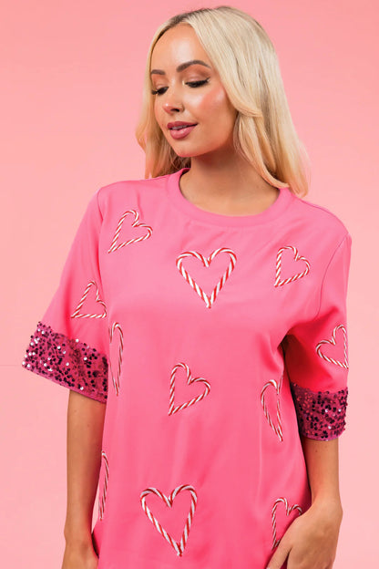 T-shirt de sport féminin avec un motif de cœur espiègle et des manches scintillantes Chic und Stil