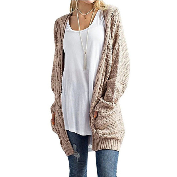 Veste en tricot pour femmes avec poches et structure à motifs en torsades détaillée Chic und Stil