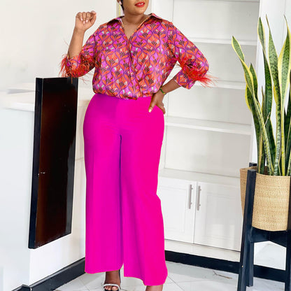 Expressive outfit for women with printed blouse and wide pants Chic and Style