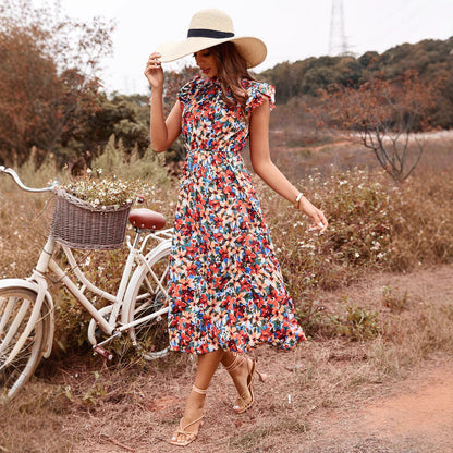 Robe maxi femme avec un imprimé floral joyeux et des détails volantés Chic und Stil