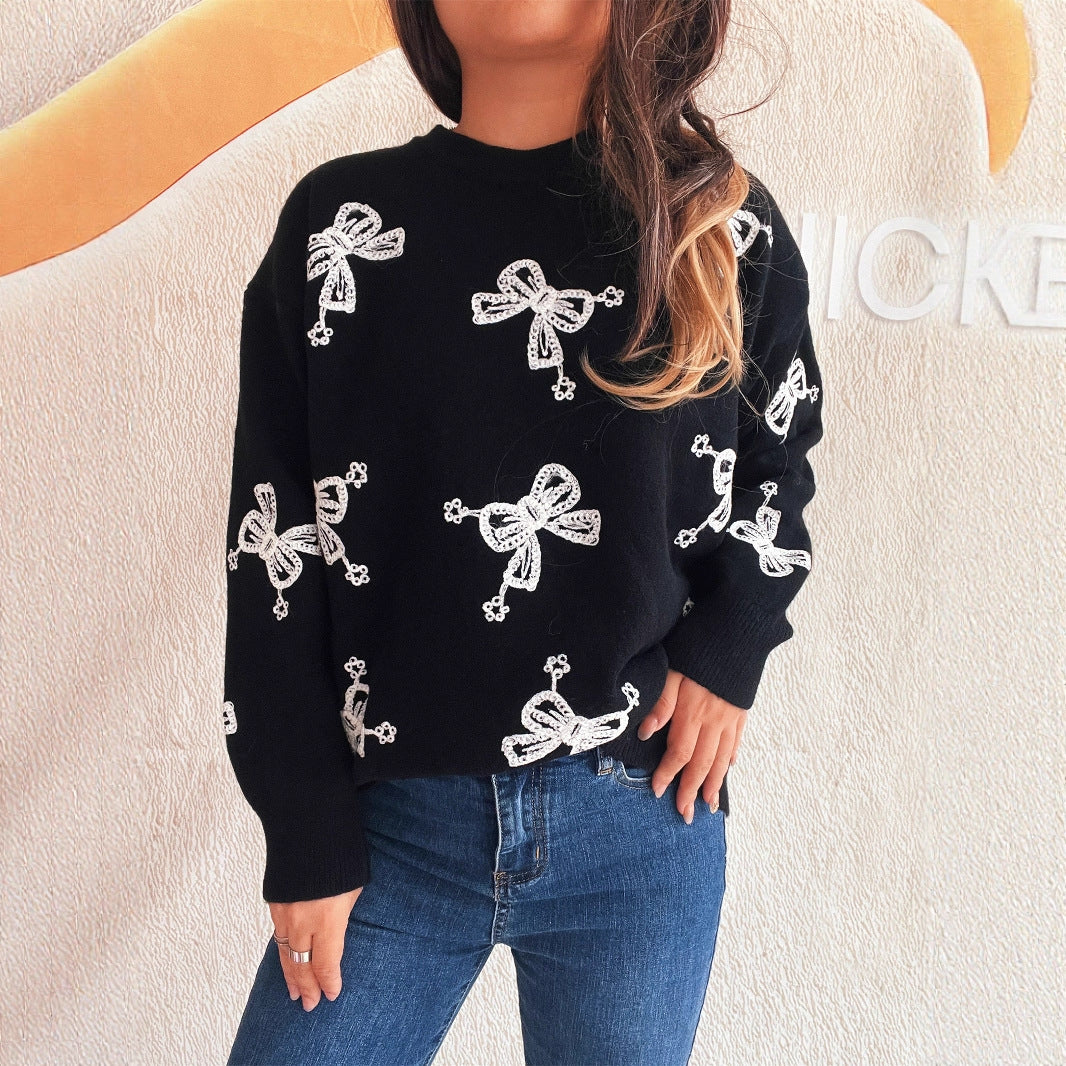 Pull femme avec motif de nœud ludique et coupe décontractée Chic und Stil