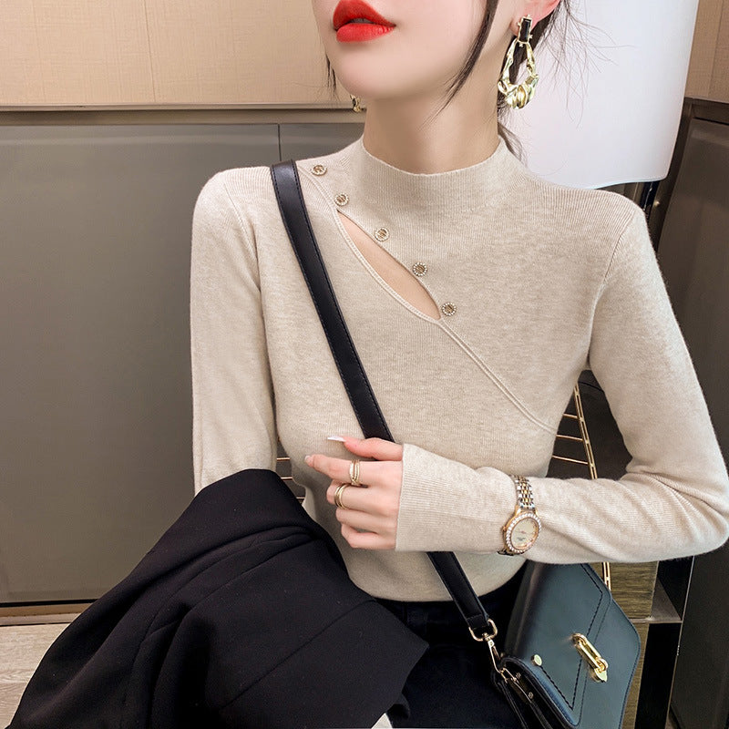 Pull élégant pour dames avec coupe asymétrique et détails de boutons Chic und Stil