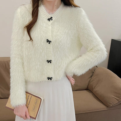 Dames pull-over en laine moelleux avec des boutons décoratifs en nœud Chic und Stil
