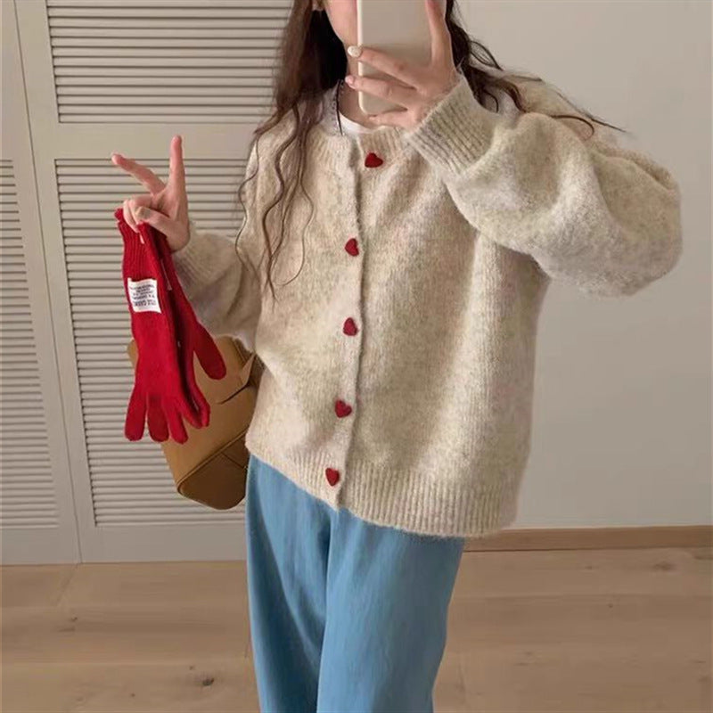 Dames pull-over tricot doux avec boutons en forme de cœur Chic und Stil